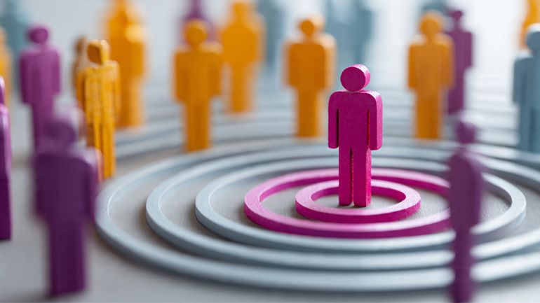 Data analyst examining complex digital dashboards to extract insights on what is customer segmentation for better marketing decisions.